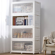 A white stackable storage cabinet with four cubes, each having a clear front panel, placed on wheels and situated in a home environment.